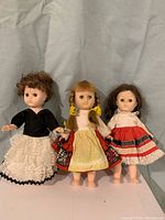 Front view of the 3 vintage Ginny dolls showing their clothing and facial features