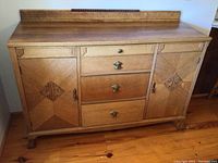 Front overall view showing two cabinet doors and three central drawers