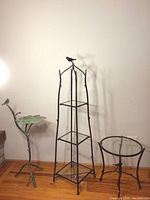 Full view of all three items: leaf tray table, three-tier shelf, and round glass side table