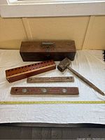 Overview photo showing all items laid out with the wooden box behind them.