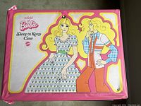 Pink vinyl World of Barbie Sleep’n Keep Case, featuring brightly colored 1974 Barbie cartoon graphics, pink zipper border, showing overall condition and design.