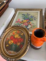 Photo showing the large rectangular framed flower painting with purple and pink flowers alongside oval framed flower painting and the Jasba ceramic vase.
