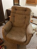 Frontal view of the beige oversized fabric desk chair showing cushioned high back, armrests and seat.