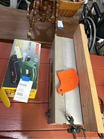 Top view showing Bosch PHO 100 boxed planer and Shopcraft jointer-planer with wooden guide and orange guard