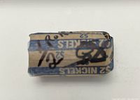 Paper roll of $2 in nickels, marked NICKELS $2 wrapped tightly
