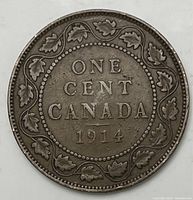 Photo of reverse side of 1914 Canada large one cent coin showing maple leaf wreath and date.