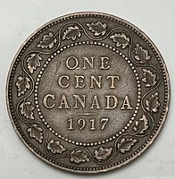 Reverse view of 1917 Canadian Large One Cent coin showing denomination and date within maple leaf wreath.