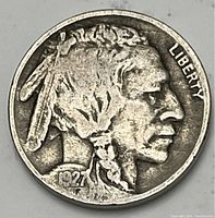 Obverse of 1927 Buffalo Nickel showing Native American bust, date 1927, and LIBERTY text.