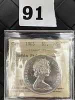 Obverse view of the 1965 Canadian one dollar silver coin showing Queen Elizabeth II