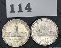 Photo of both 1939 and 1966 Canadian silver dollar coins together showing obverse and reverse sides.
