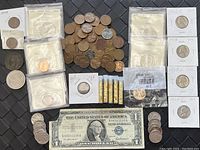 Overview of all coins including loose pennies, silver certificates, and gold vials.