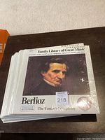 Stacked vinyl albums from Funk & Wagnalls Family Library of Great Music series, showing Berlioz album cover on top.