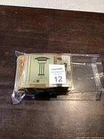 Large stack of 1990 Pro Set sports trading cards held in plastic sleeves, seen from the side showing thickness and quantity.