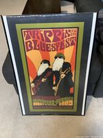 Framed Ottawa Bluesfest 2005 poster featuring ZZ Top with two bearded musicians and psychedelic text.