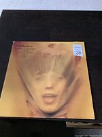 Front cover of The Rolling Stones Goat's Head Soup vinyl album showing blurred face artwork and album title text.