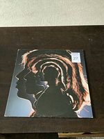 Front cover of The Rolling Stones Hot Rocks 1964-1971 vinyl album featuring artistic silhouette profile of band members.
