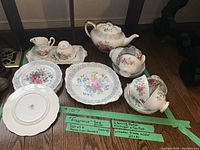 All bone china items grouped on floor with tape labels