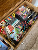 Drawer with scissors, markers, pens, and Scotch tape