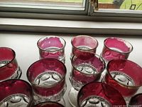 Close-up of the top section of the ruby glasses showing the color loss and wear on the rims.