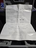 Photo showing instruction sheet illustrating all included accessory pieces and rotary tool details