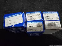 Five boxes of sheet metal screws, showing sizes and labels: 6 x 1/2 inch and 6 x 5/8 inch, pan head combo, zinc plated, 100 pieces each.