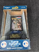 Front view of boxed Roger Maris pewter figurine with certificate of authenticity inside, labeled Sports Illustrated Collection and Major League Baseball