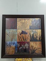 Front view of the floral multi-panel print framed in large bamboo frame.