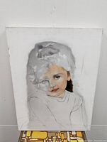 Front view of unfinished painting of a young girl on canvas