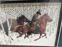 Close-up photo of the framed print showing a Native American rider on horse through birch tree forest with detailed imagery and colors.