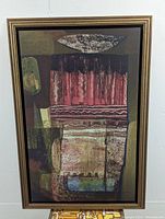 Full view of the large vintage Mid-Century Modern canvas print within a heavy decorative wood frame showing abstract earth tone shapes and textures.