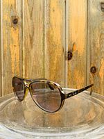 Front three-quarter view showing frame shape and lens tint