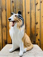 Front angle of the Rough Collie dog statue showing detailed facial features and coloration.