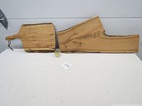 Both butternut wood boards and jar of beeswax finish displayed together on neutral background.