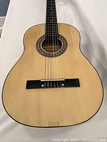 Front view of guitar body showing top finish and bridge