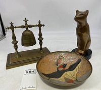 Photo showing all three items together: brass cat sculpture, brass bell on stand, and enameled brass bowl.
