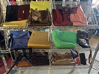 Top shelf and middle shelf displaying a variety of handbags and clutches in multiple colors and materials