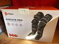 Front of retail box showing Lifepro Radiate Pro branding and graphic of leg massager sleeves