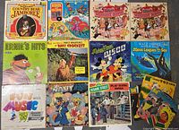 Full overview of all 14 children's music albums showing illustrated covers of Walt Disney, Sesame Street, and others.