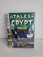 Front cover of the hardcover book titled 'Tales from The Crypt: The EC Archives Volume 1' showing illustrated horror comic artwork.