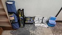 Full lot showing Orion dome tent bag, Escort twin bed bag, butane stove case, waterproof bags, Rubbermaid cooler with ice packs