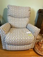 Front view of the La-Z-Boy rocking recliner chair showing fabric pattern and overall condition.