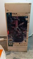 Full unopened box of the Folia water fountain showing the product image and brand details.