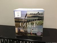 Photo of the Athletico Executive Golf Travel Cover box, showing the product name, brand, and image of a golfer.