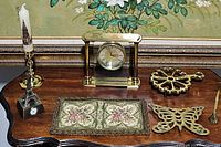 Photo of the collection on a wooden desk with a floral backdrop