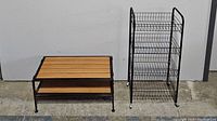 Two racks side by side; a wood and metal shoe rack on the left and a tall black metal basket rack on the right