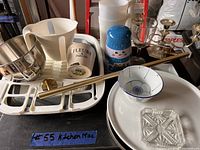 Photo of kitchen miscellaneous lot items showing drying rack, mixing bowl, measuring pitcher, ceramic and glass containers, plates, and rod.
