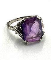 Close-up three-quarter view of the ring face and amethyst