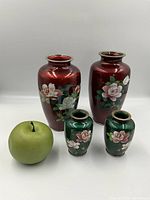 All four vases with green apple for scale