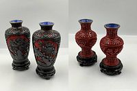 All four vases on their wooden stands arranged in a row