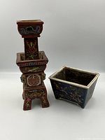 Both candlestick holder and planter pot displayed side by side